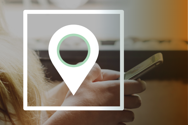 Someone on their phone with a map icon